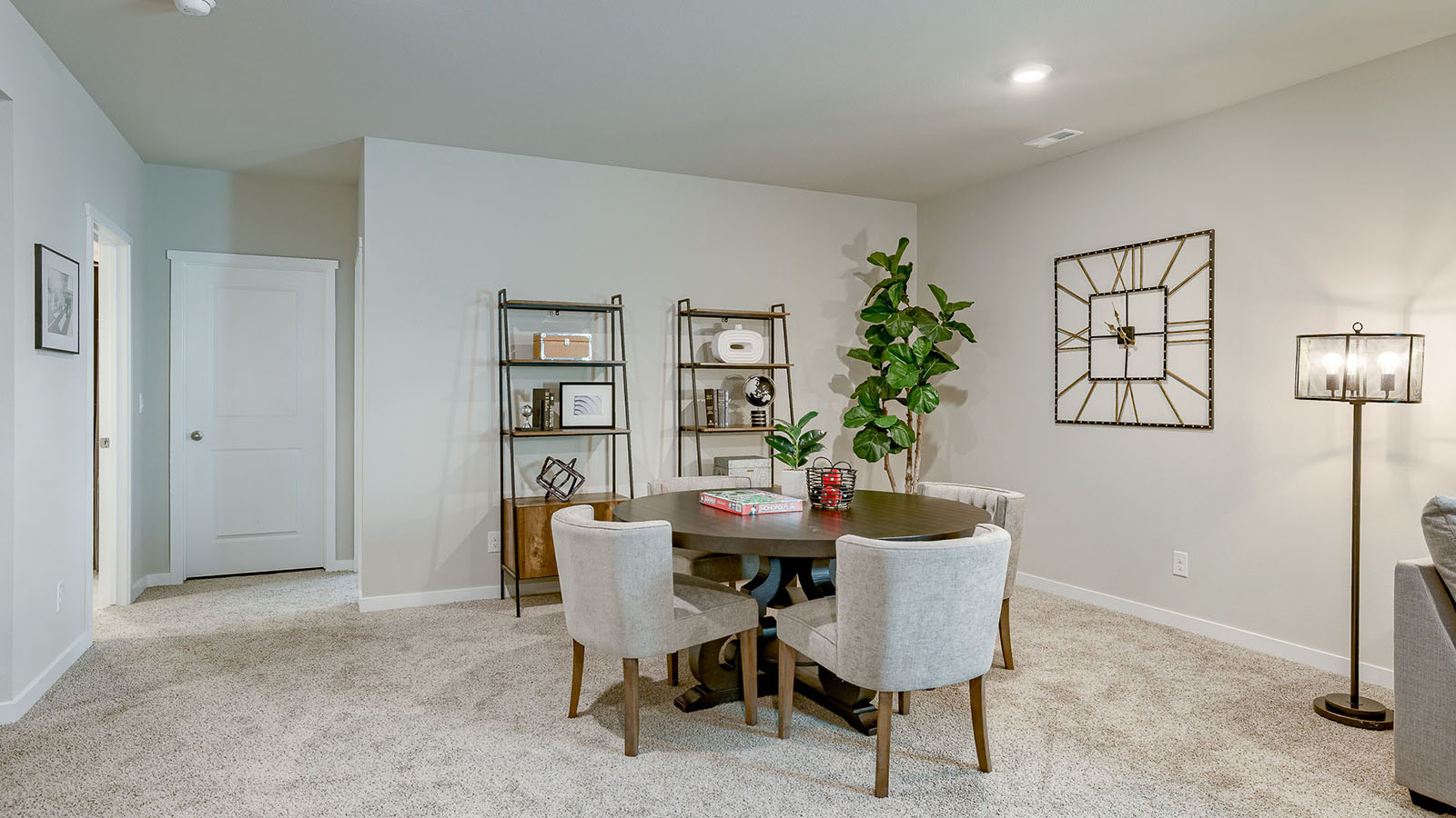 Reagan basement with card table and shevling