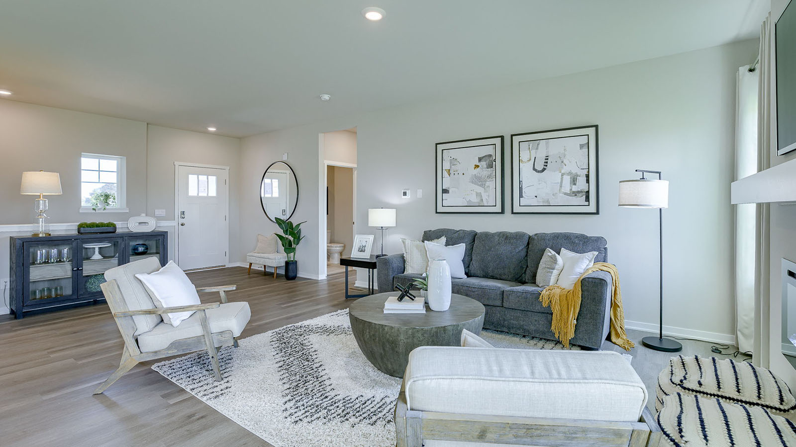 Reagan living room show casing the entry way