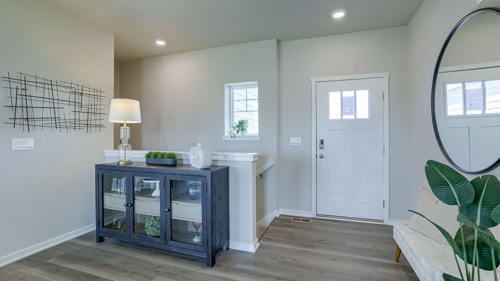 Entry way of the Reagan with a dark grey dresser