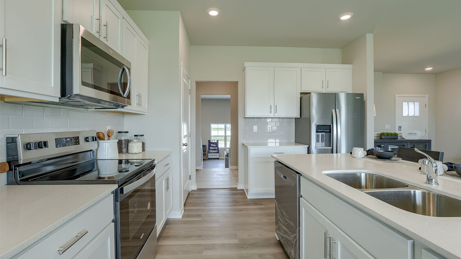 Reagan Kitchen with entry way from the garage where the laundry room is located