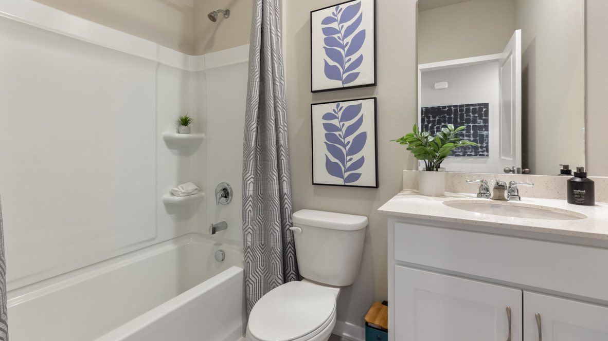 First bathroom with shower and bathtub