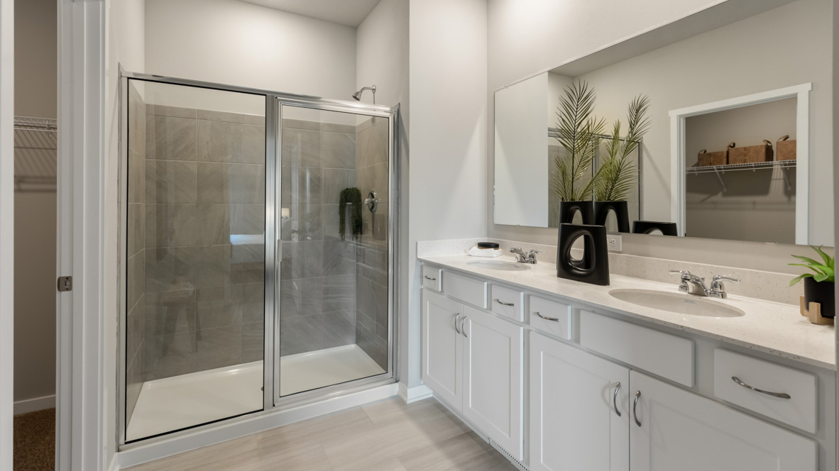 primary bathroom with glass shower doors