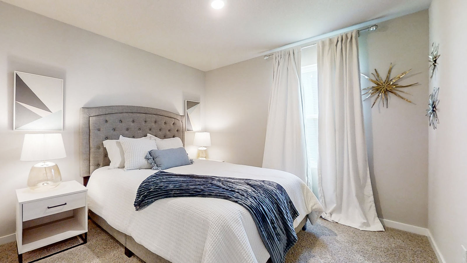 Second bedroom of the Hamilton with a full bed and two night stands