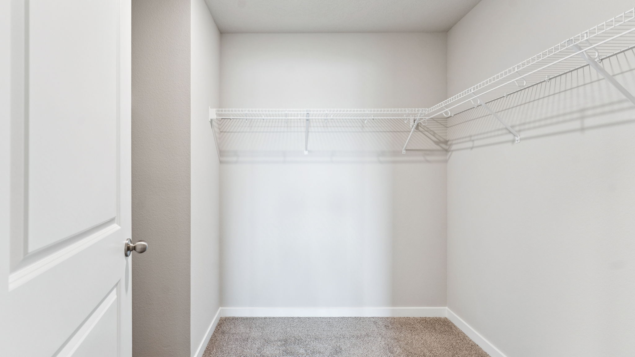 Primary walk-in closet in the Hamilton