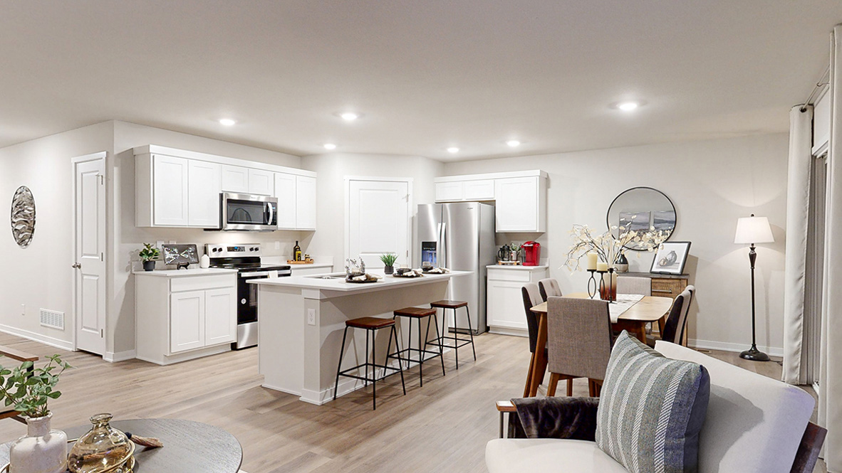 Hamilton living room looking into the kitchen and dining area