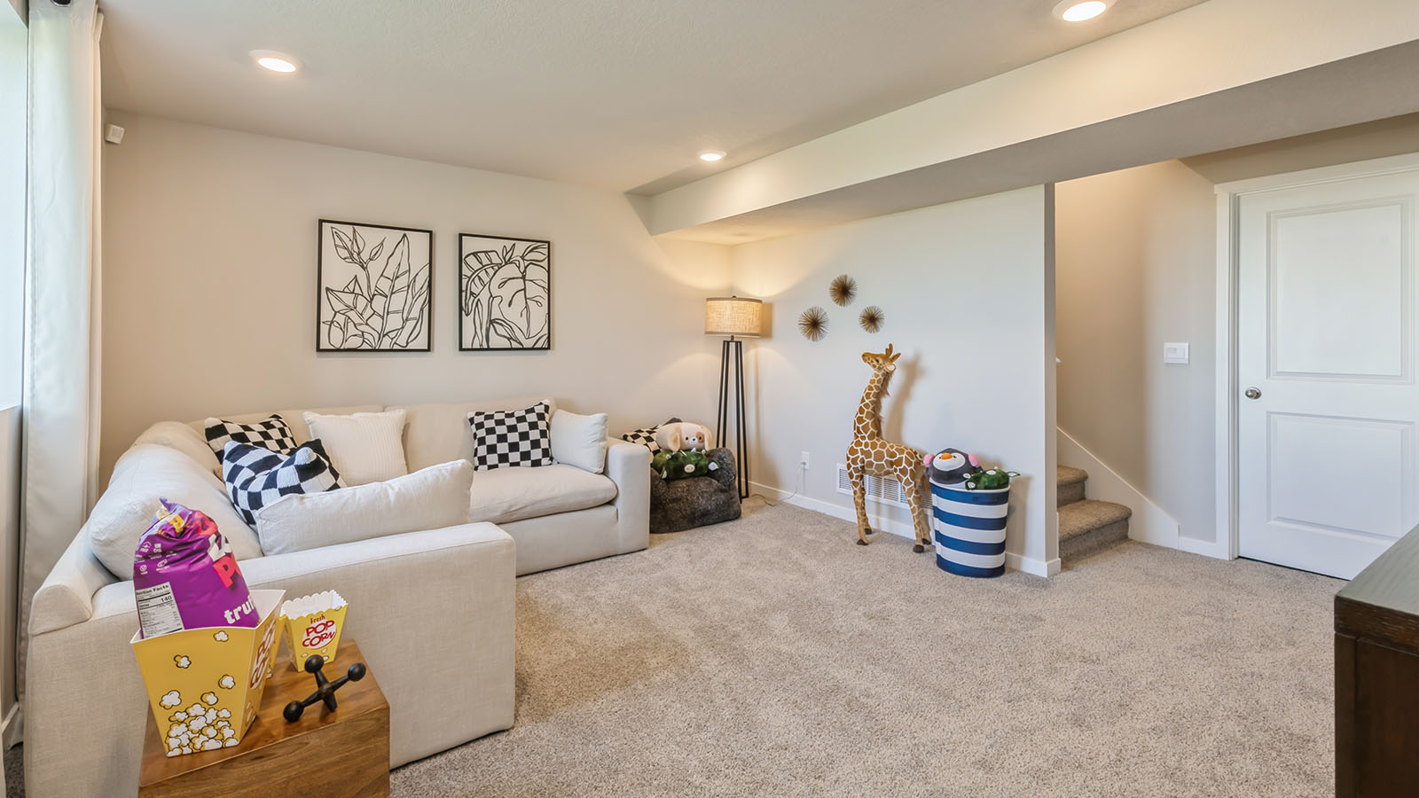 Spacious finished basement with cozy couch and decorations