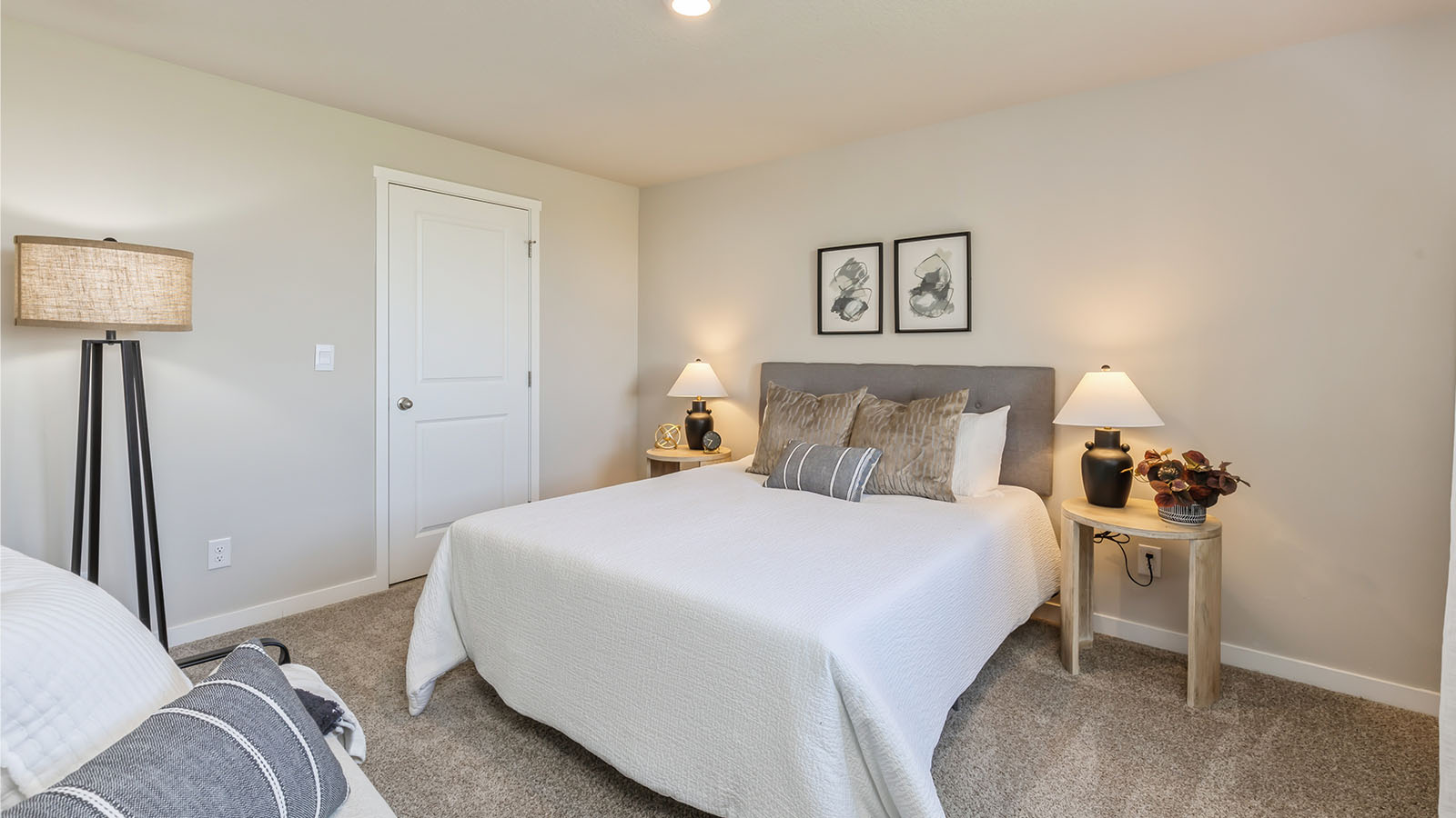 Fourth bedroom with floor lamp and nightstands