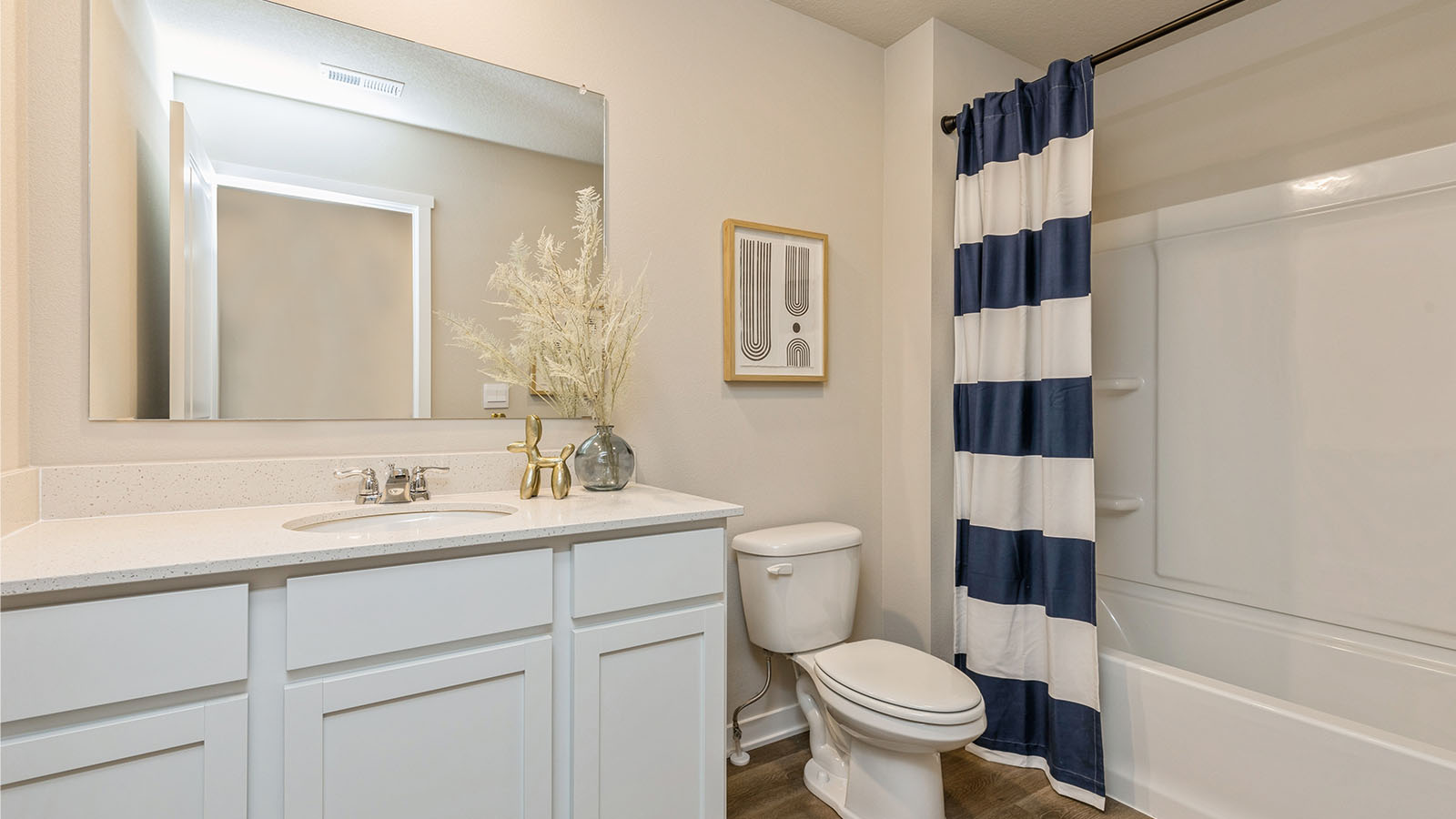 Second bathroom in basement with sink and bathtub