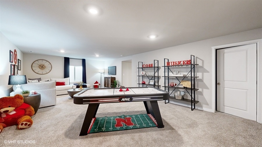 finished Abbott Basement showing loung area and entertainment area