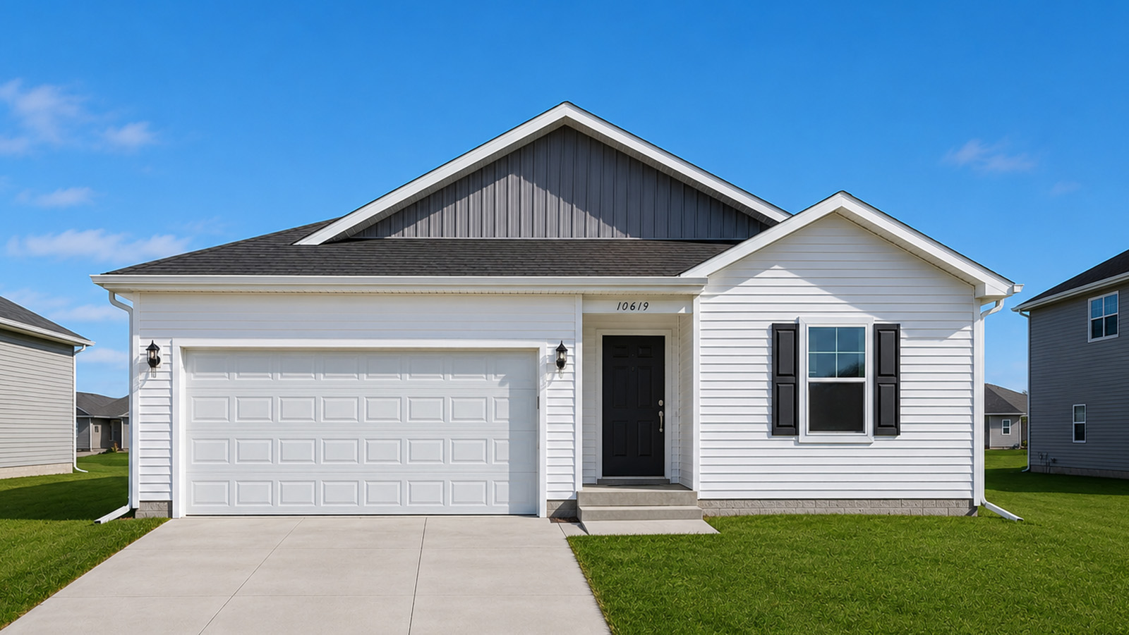 Exterior of the freeport plan with white siding, tan brick, and a 2-car garage
