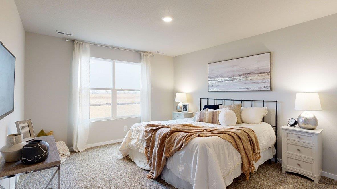 Hamilton primary bedroom with a king bed and two night stands