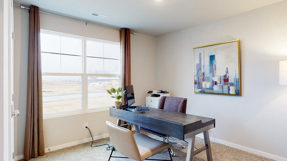 second bedroom staged as an office