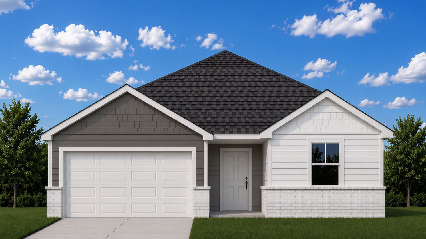 Exterior of the Freeport with white siding and tan brick with a two car garage