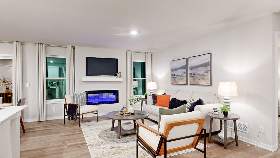 Hamilton living room with couch and two chairs around a coffee table