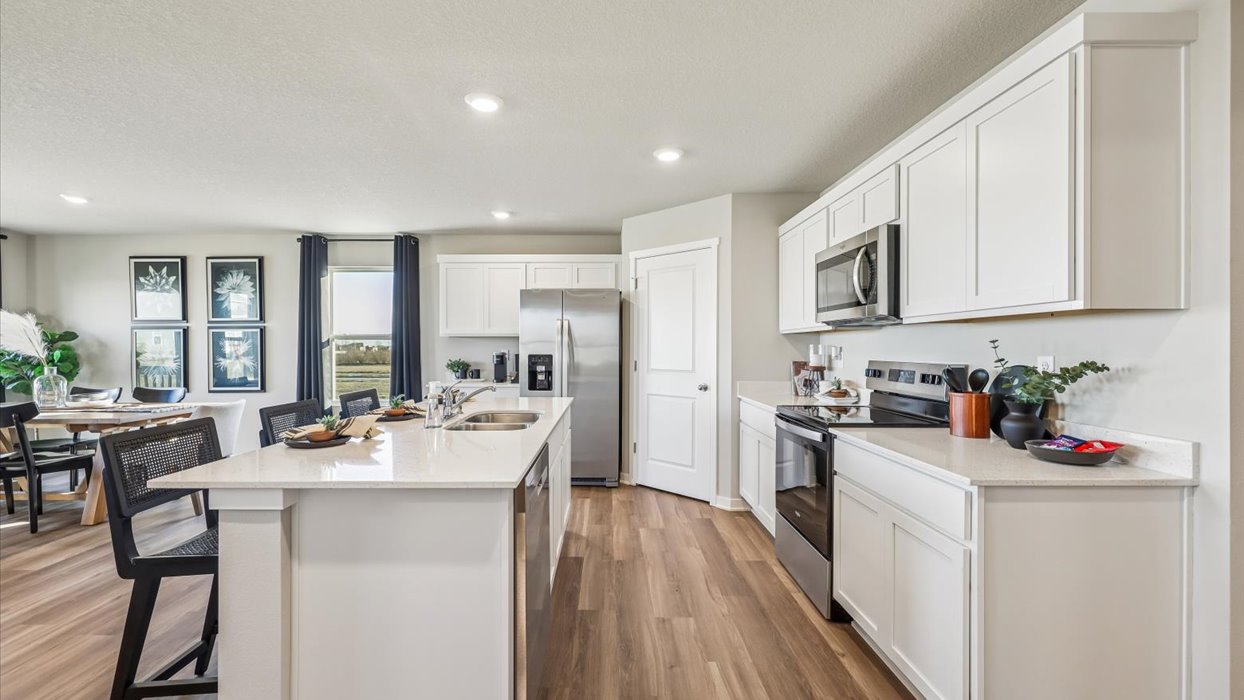 Overview of kitchen in Neuville with stainless steel appliances