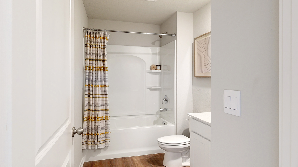 Second bathroom in the Freeport with a bathtub toilet and sink