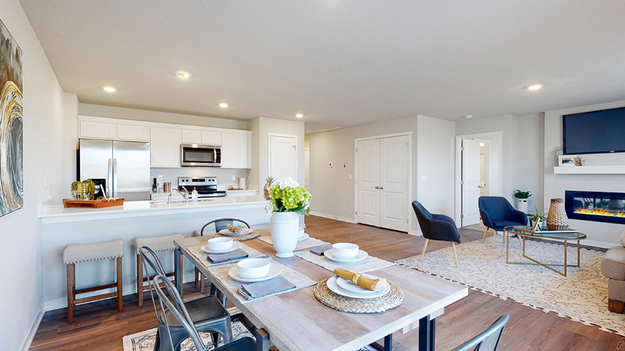 Freeport dining area with table bench and 4 chairs overlooking the kitchen and living room