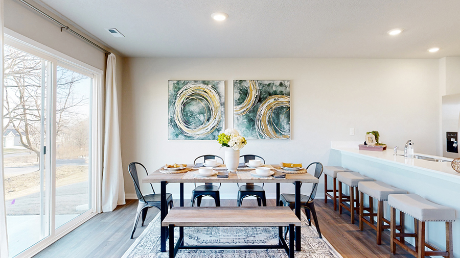 Overview of the Freeport dining area with seating for 10 and sliding glass doors