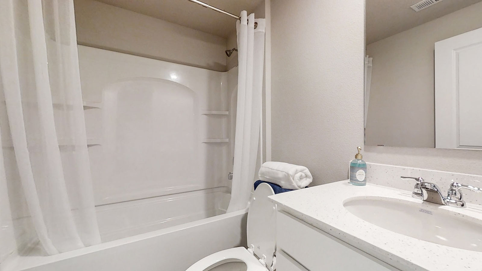 Third bathroom in the Hamilton finished basement with bathtub