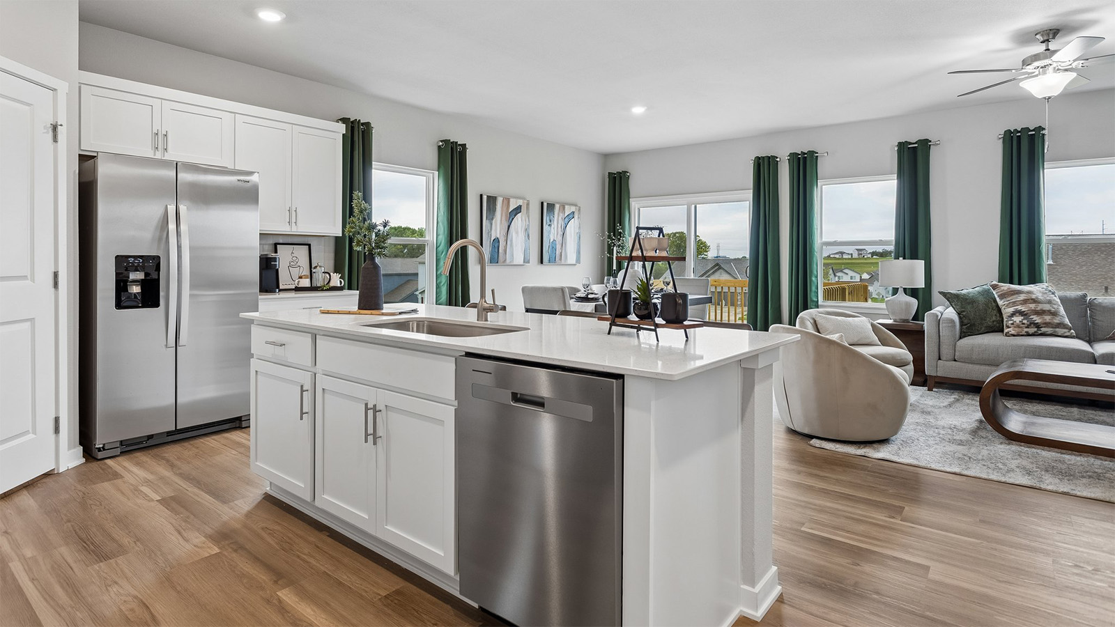 Neuville kitchen with center island and stainless steel appliances