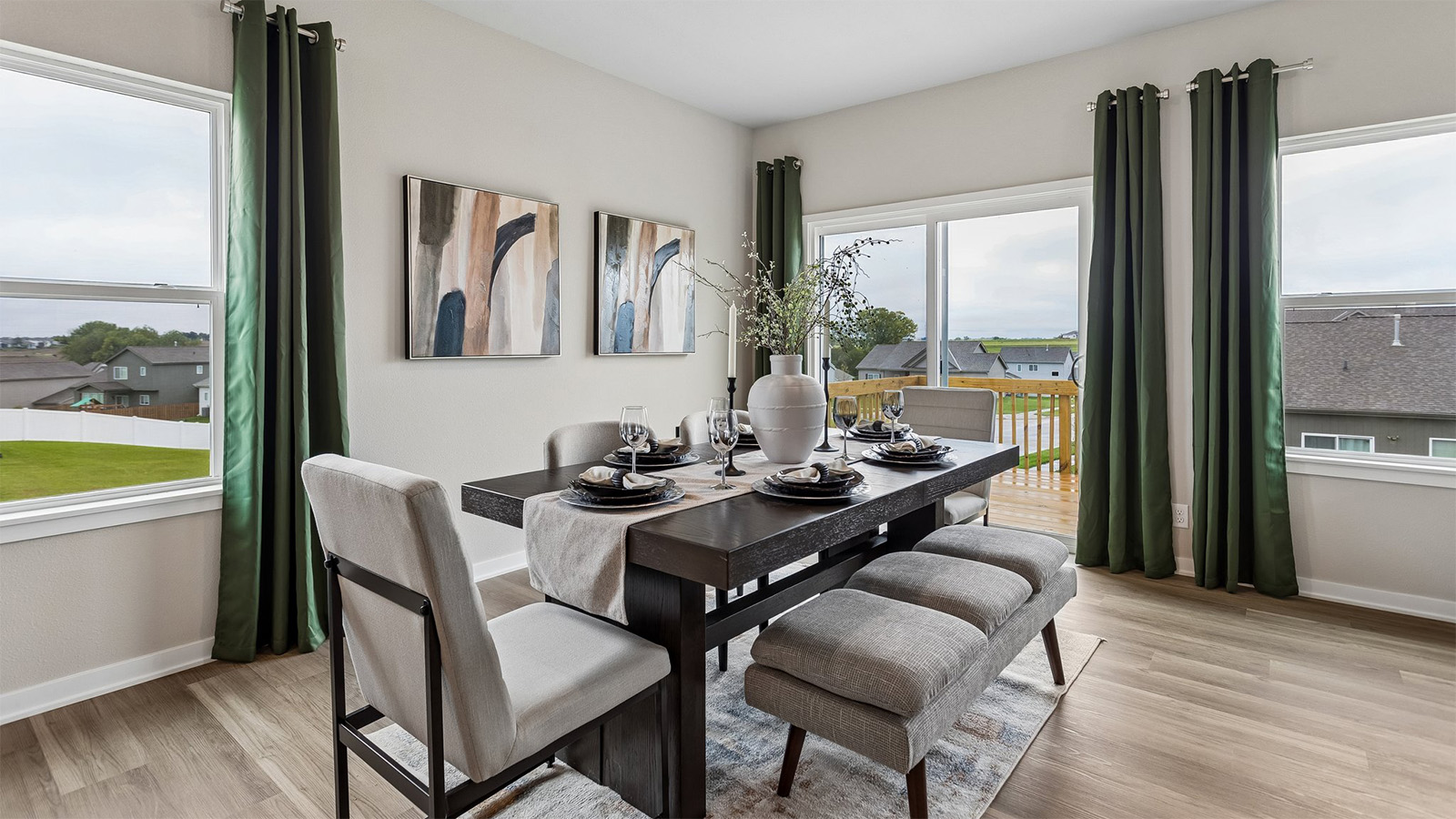 Neuville dining area with sliding glass doors leading to the deck