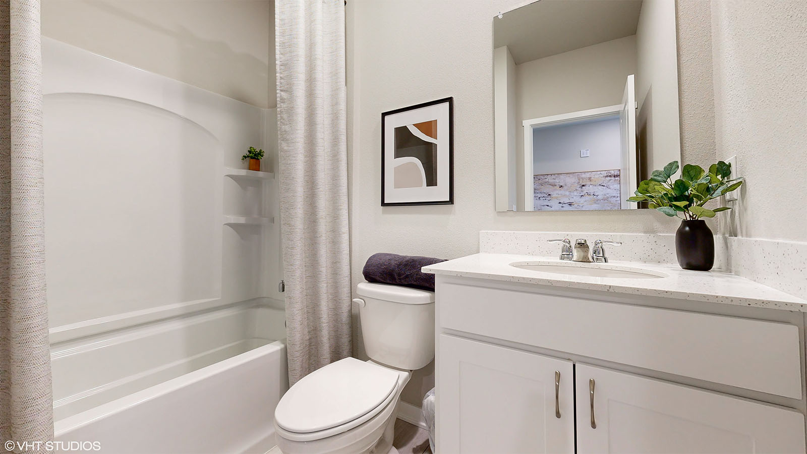 Second bathroom in the Fairfiled with a bathtub toilet and sink