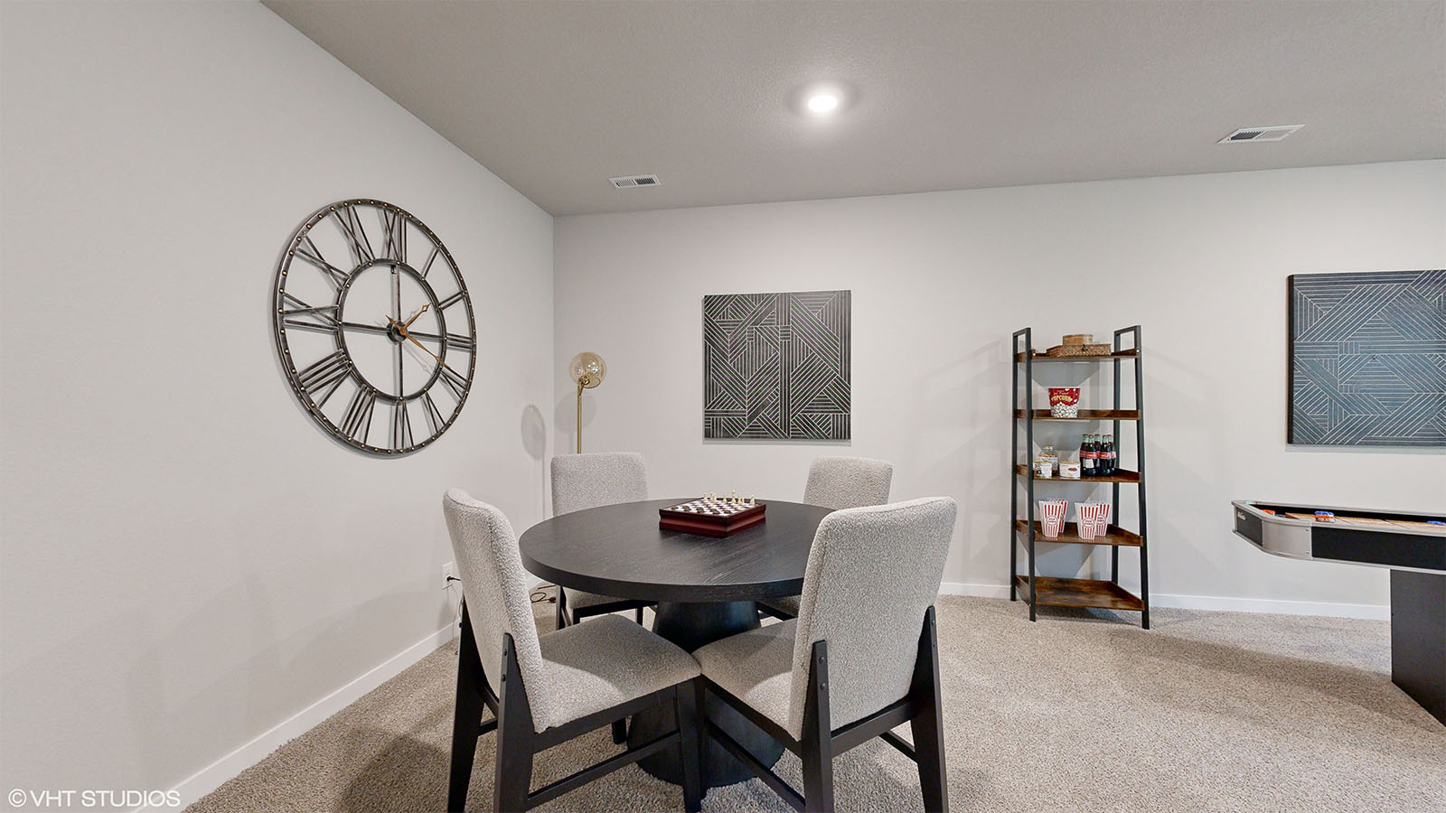 Finished basement family room in the Fairfield with a seating and game area