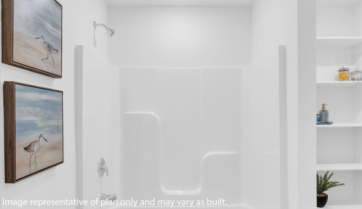 Master bathroom featuring a shower/tub combo with built in shelves