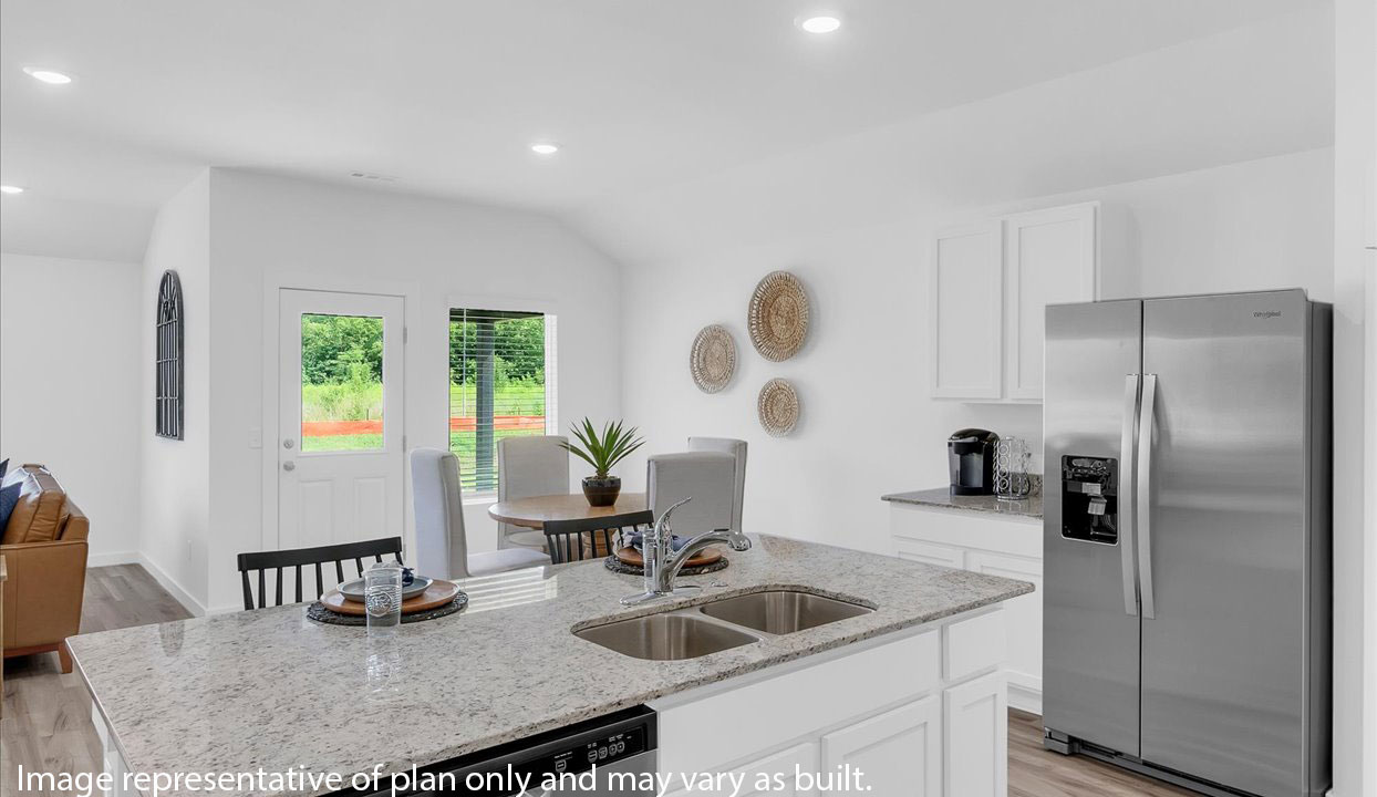 Modern open-concept living and kitchen peninsula with white cabinets and stainless steel appliances.