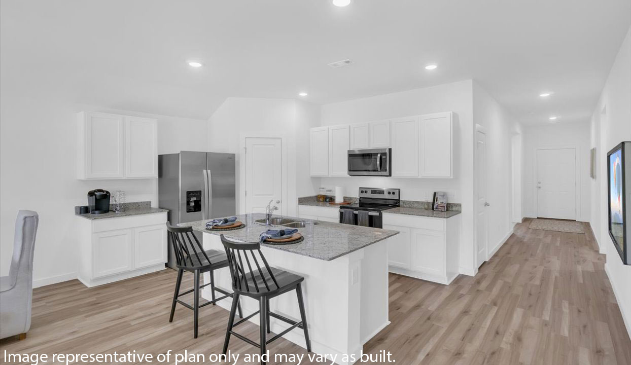 Modern open-concept  kitchen with peninsula that has white cabinets and stainless steel appliances.