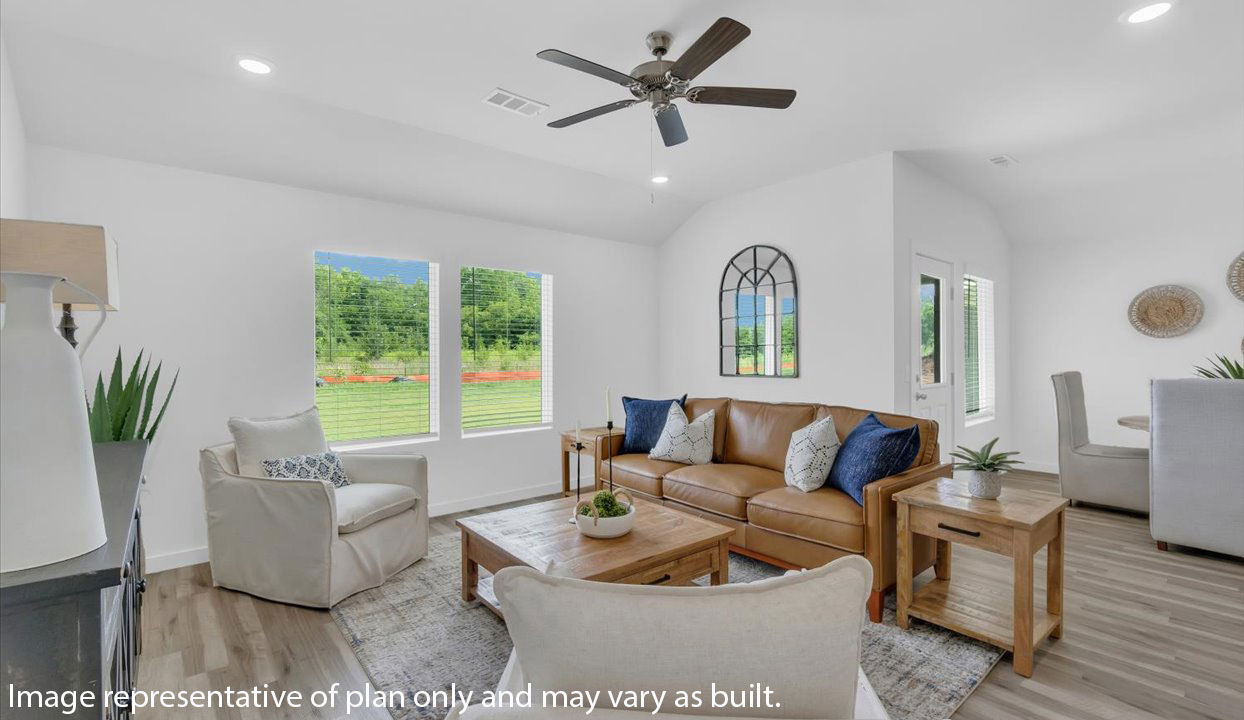 Open concept living space featuring a spacious living room area next to the dinning room.