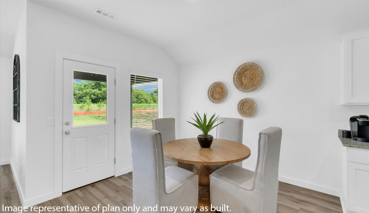 Spacious breakfast nook with door leading out to the patio.