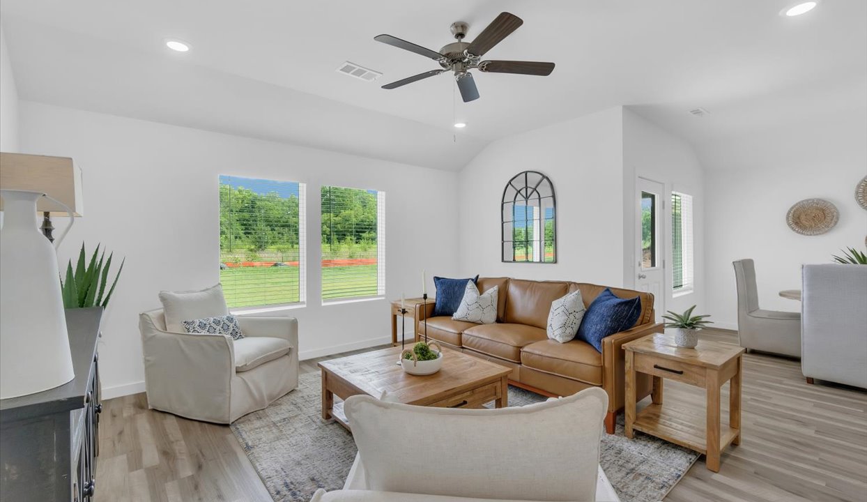 Open concept living space featuring a spacious living room area next to the dinning room.