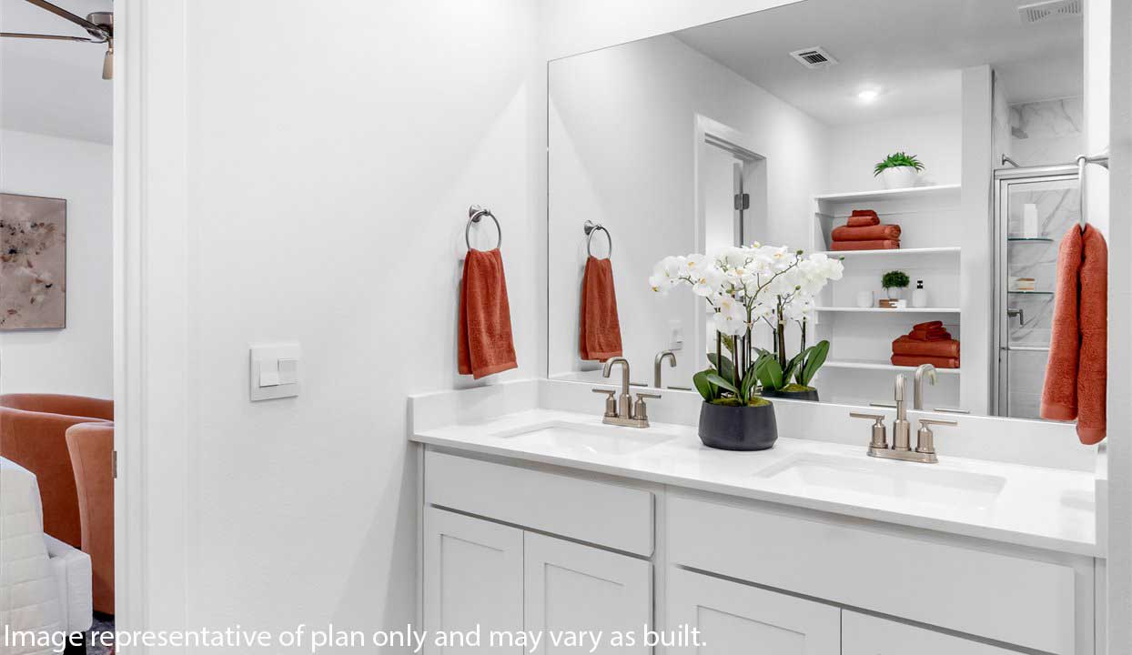 White vanity with double sinks.