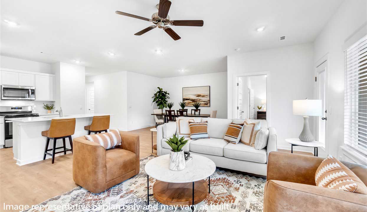 Open concept living space featuring a spacious living room area next to the dinning room.