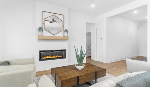 Open concept living space featuring a fireplace