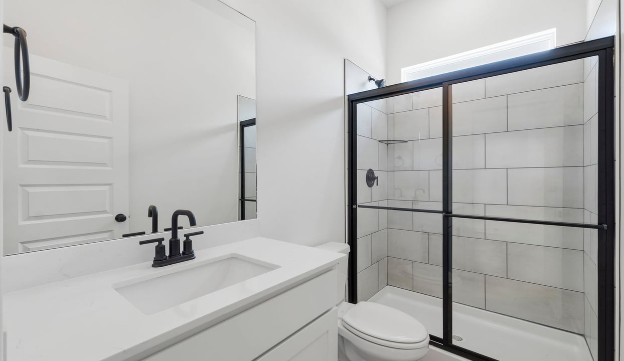 Secondary bathroom with glass enclosed shower