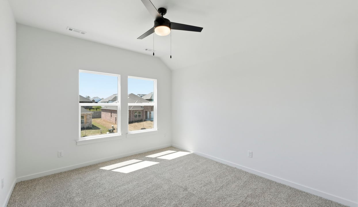 Secondary bedroom with plush carpet