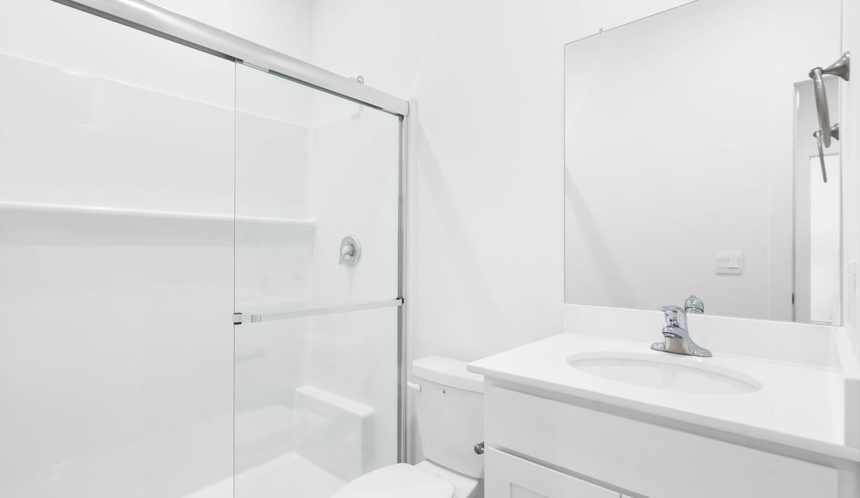 Secondary bathroom with single vanity