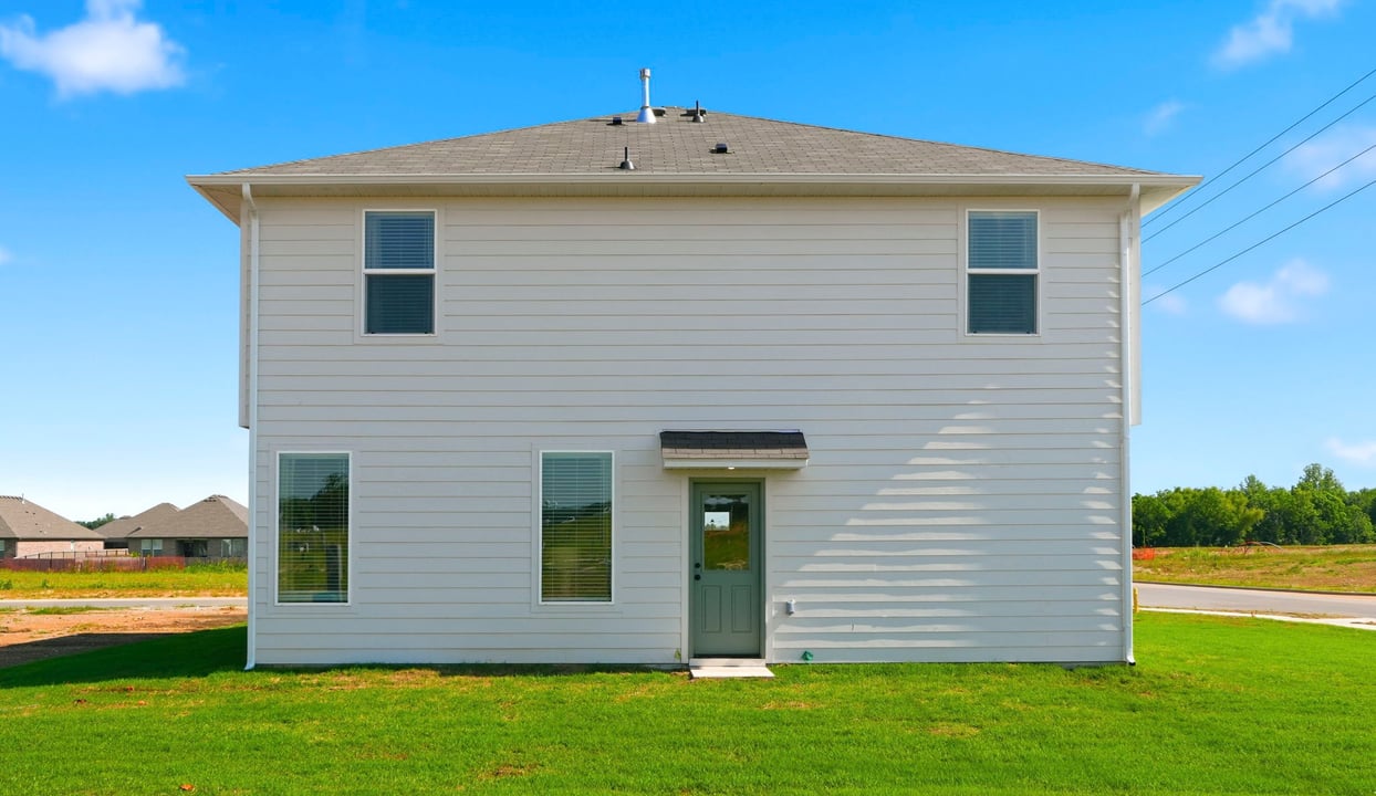 Large backyard with a well-maintained lawn