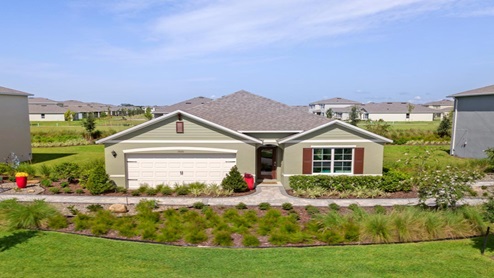 Single story new home with siding, covered porch and 2 car garage.