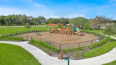 Kids outdoor playground with slide and swings.