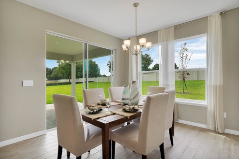 Dining room overlooking with access to backyard.