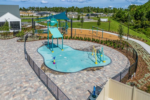 Cool off in the community pool with view of park.