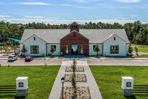 Community clubhouse with gated access, fitness and gathering areas.