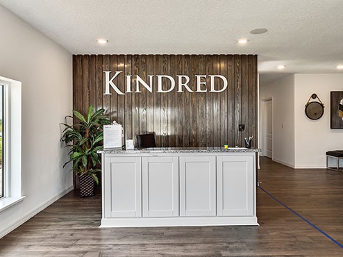 Kindred sign and entrance to model.