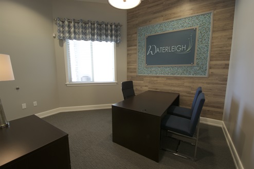 Desk with seating inside clubhouse.