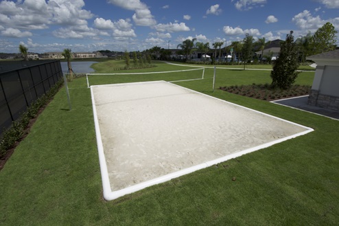 Beach volleyball area with land view.