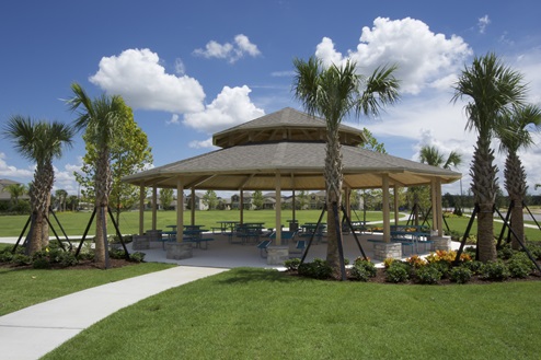 Covered sitting area amenity overseeing land.