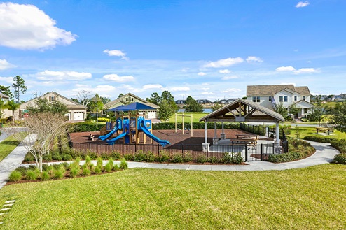 Kids outdoor playground with slide and swings.